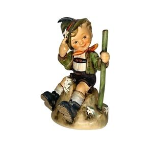 M.J.HUMMEL Mountaineer Hiker takes a rest amid Edelweiss Collectible Figurine
